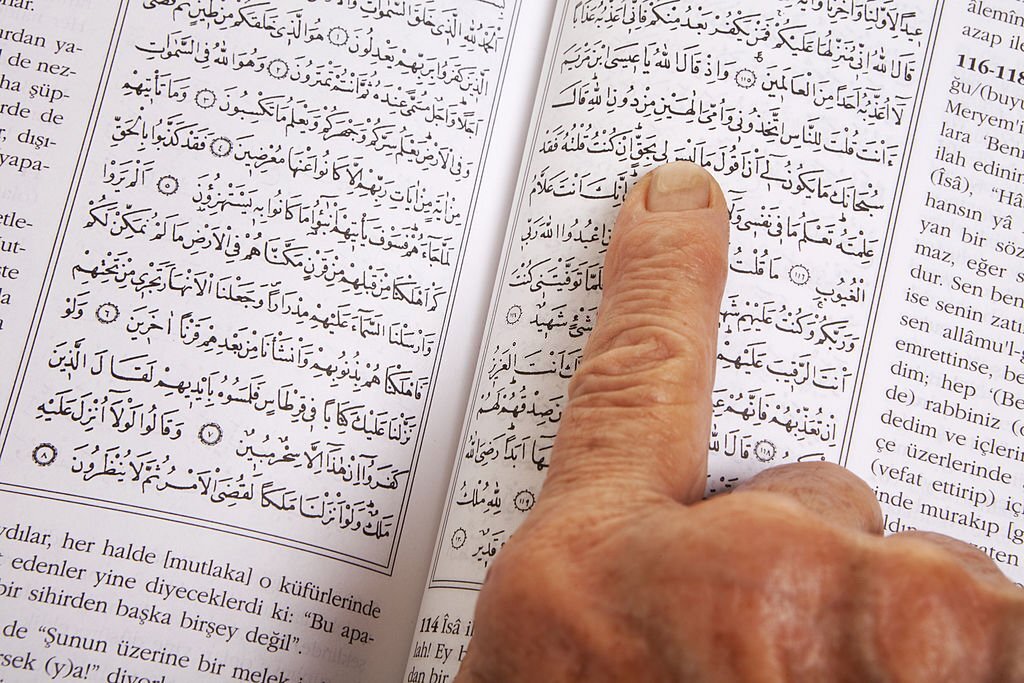 Senior Woman Reading Holy Qur'an